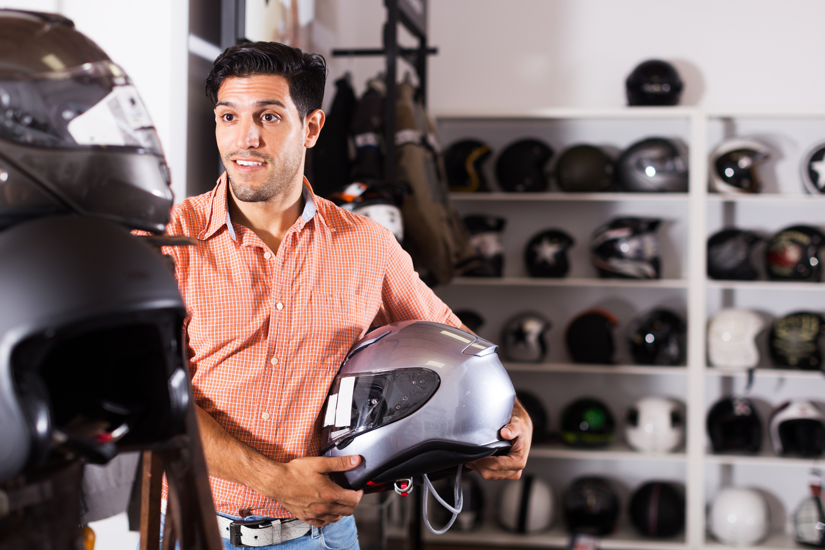 Man choosing moto helmet